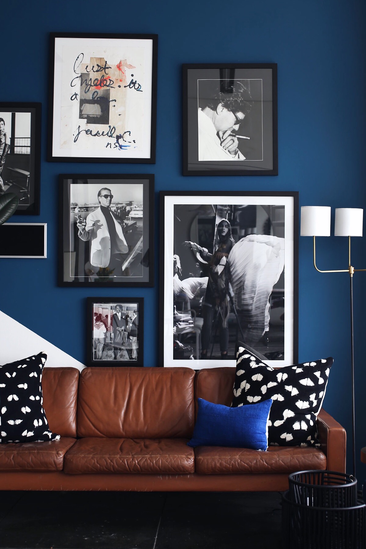 dark blue living room walls and leather sofa via @citysage