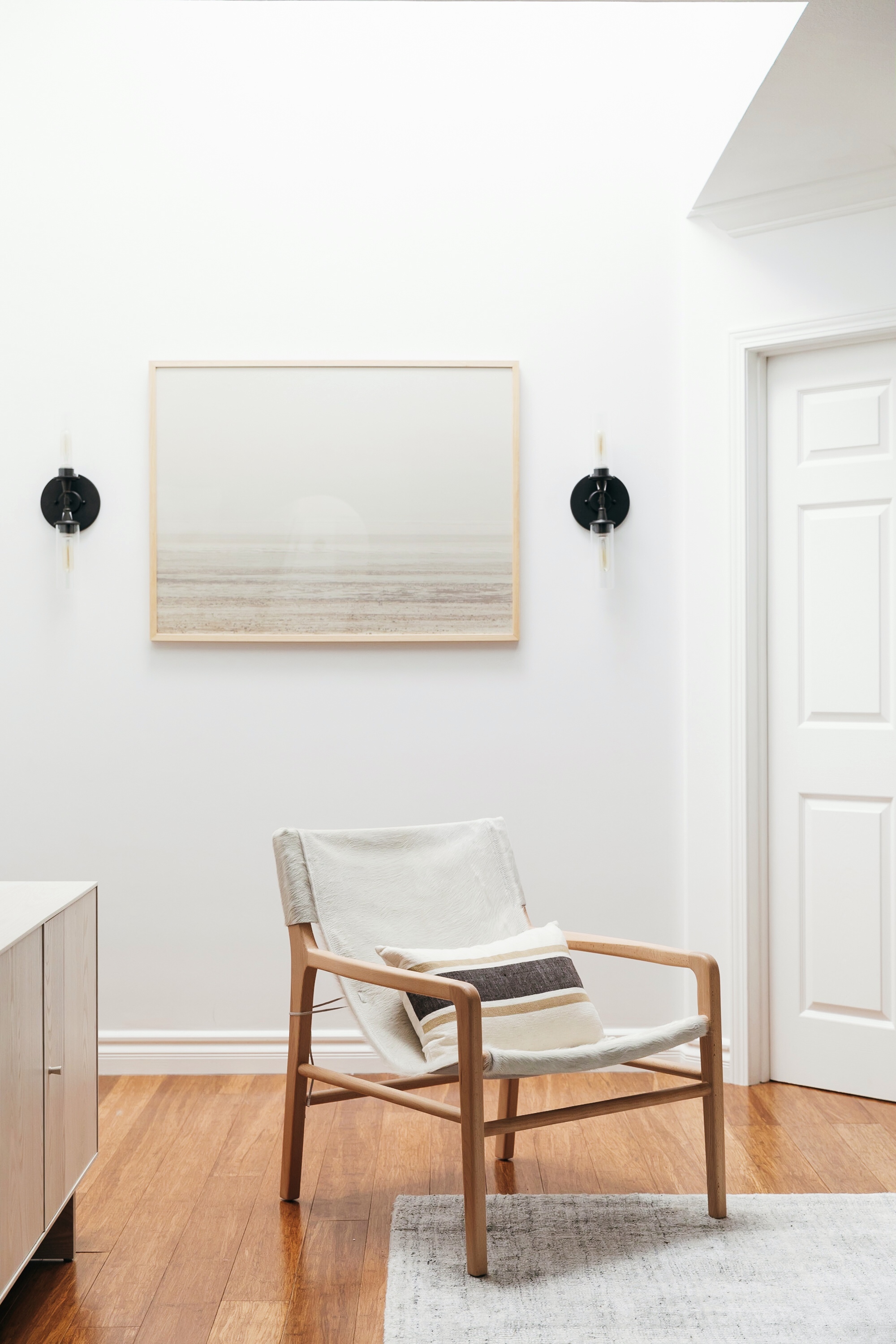 Sling Chair And Oversized Artwork Modern Neutral Living Room