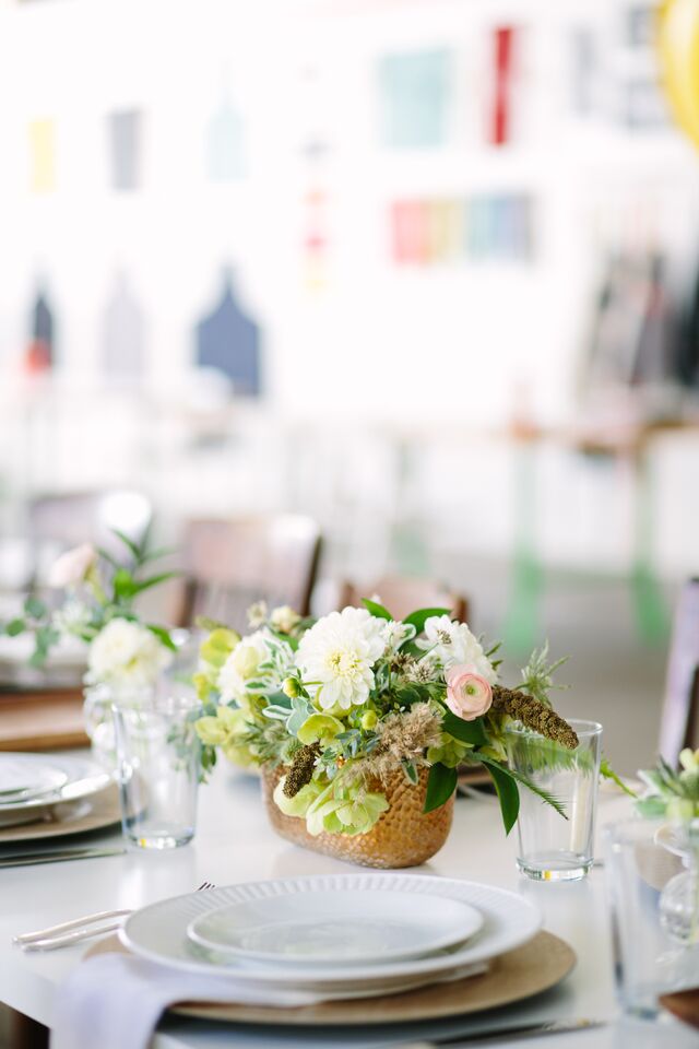 romantic floral arrangement in gold vase via anne sage