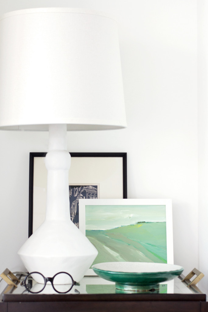 nightstand with white lamp + artwork via Anne Sage