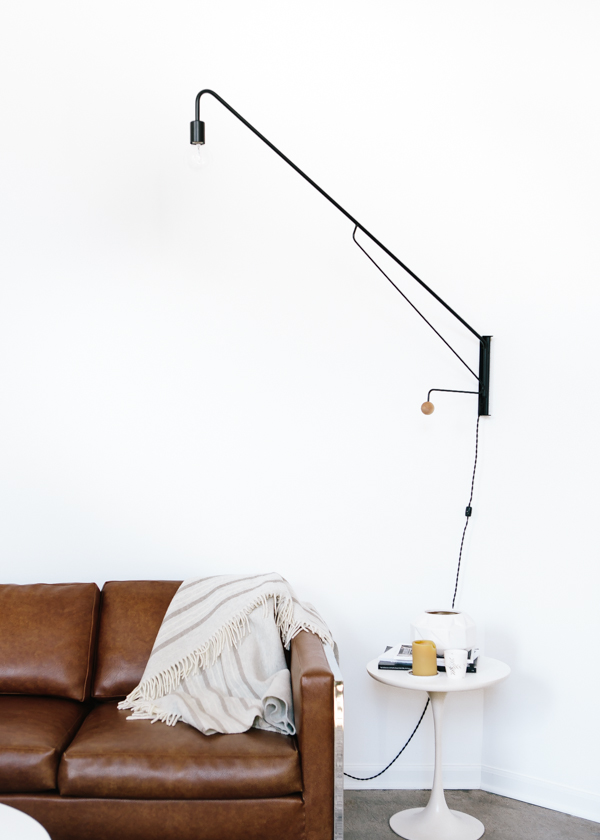 modern wall sconce + leather sofa