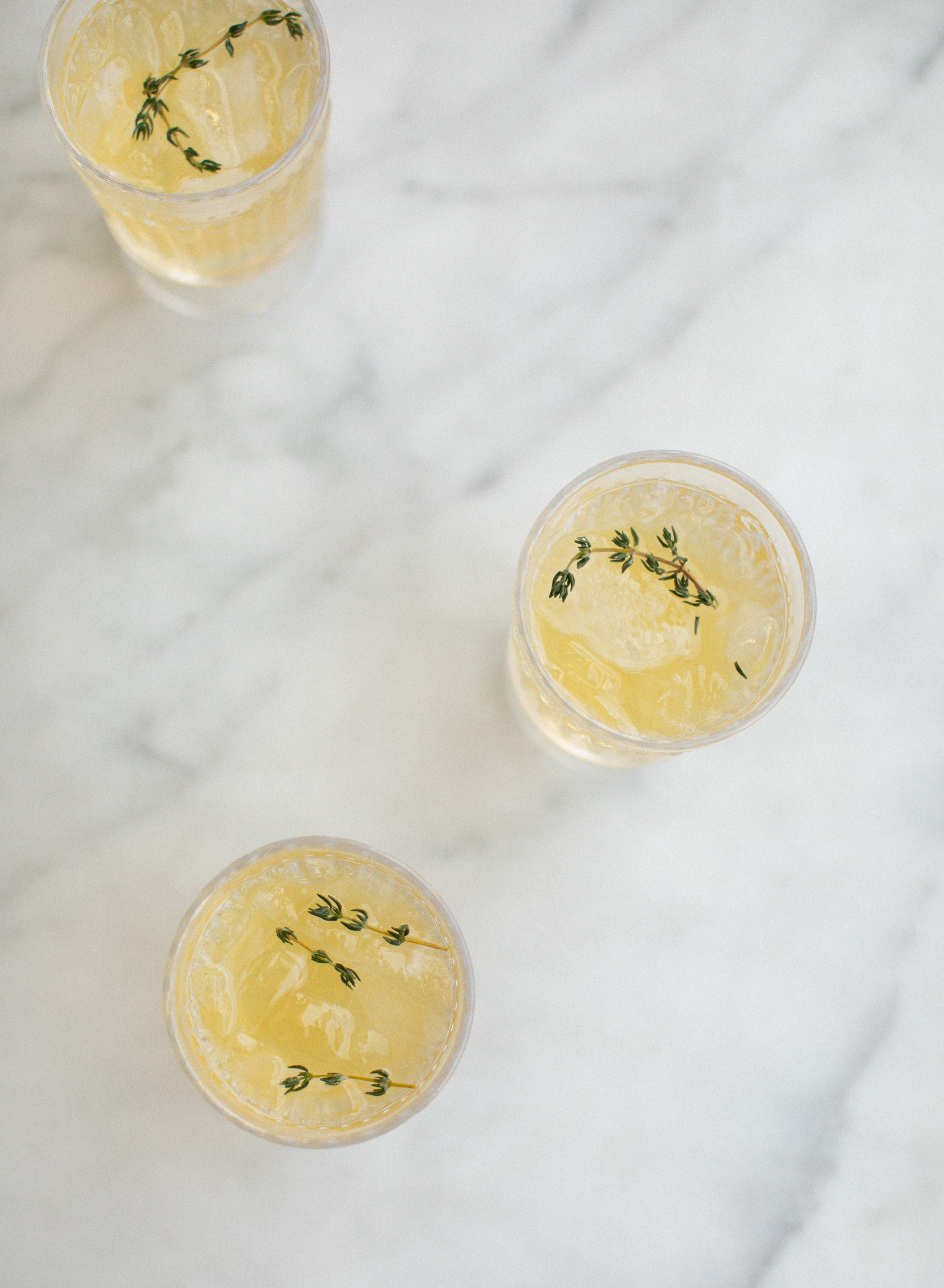 sparkling spring spritz cocktail with passionfruit and thyme
