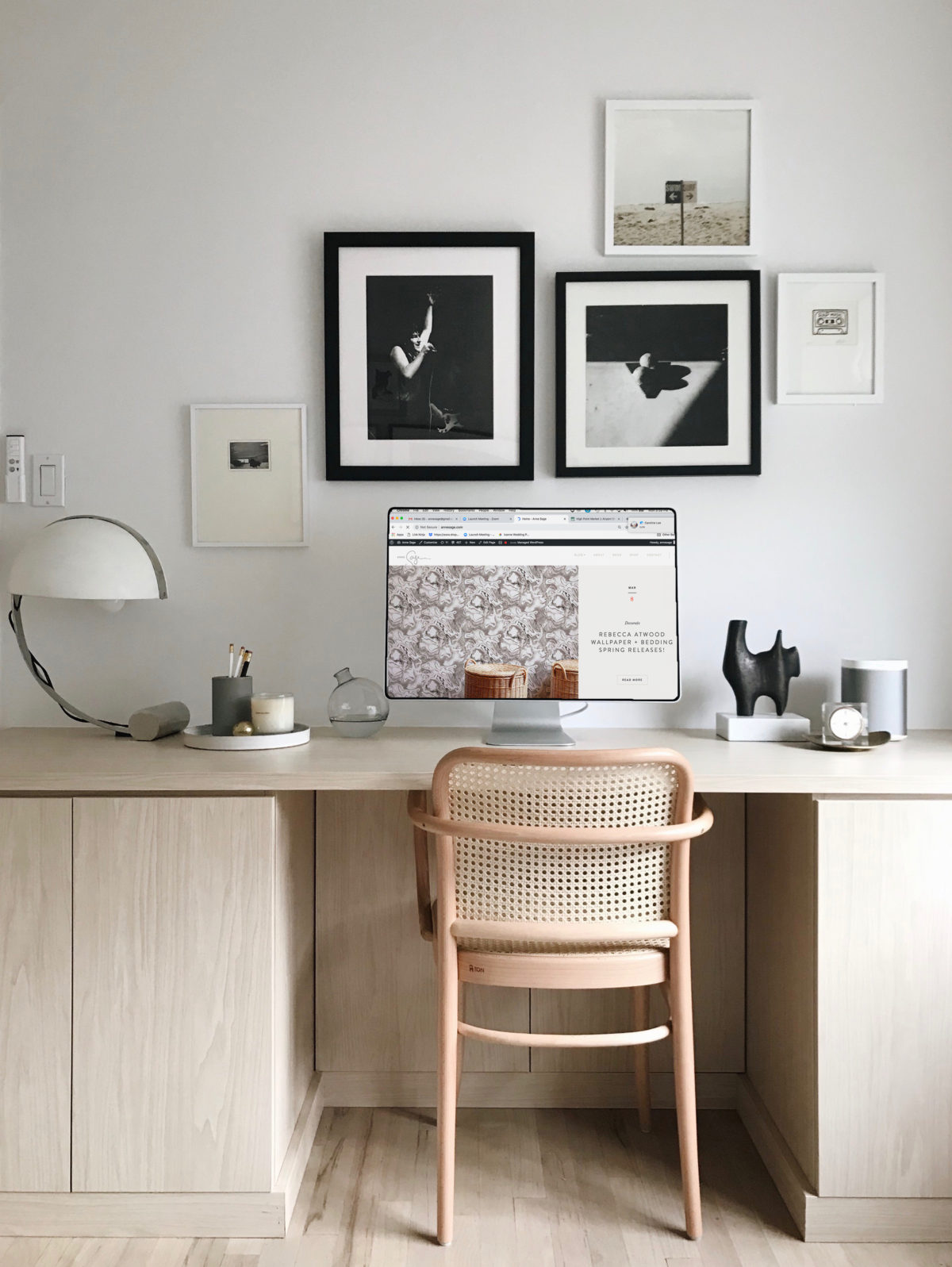 minimalist scandinavian office with woven cane chair